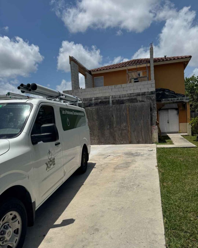 Xmart power electric van in front of a house